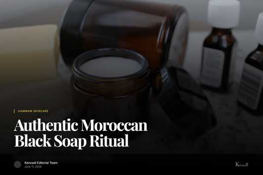 Jar of dark Moroccan black soap paste with argan oil and rose petals, beside a traditional kessa exfoliating