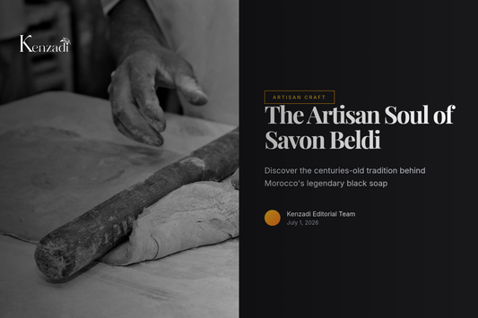 An artisan's hands holding a traditional clay pot filled with dark Moroccan black soap paste, with olives and