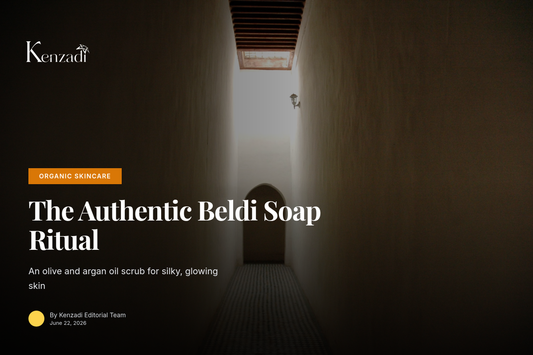 A dark green paste of Moroccan black soap in an open ceramic jar, with a kessa glove and