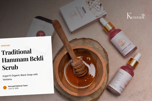 Close-up of organic Moroccan black soap paste in a wooden bowl with a kessa glove and argan oil